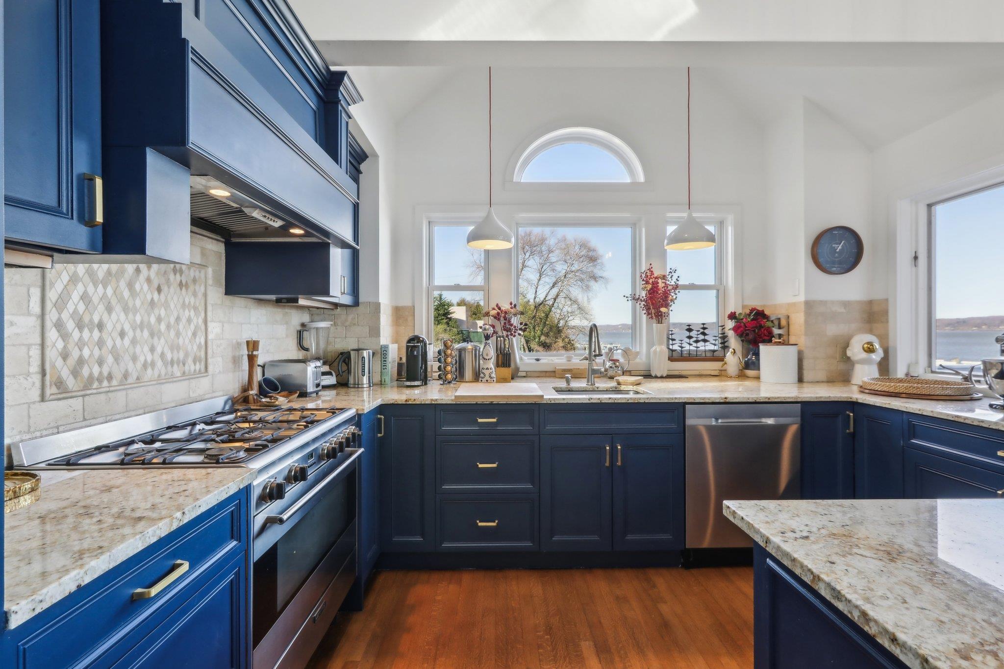 2 Washington Avenue Nyack, NY 10960 - Photo 11 of 50 a kitchen with stainless steel appliances granite countertop a stove a sink dishwasher and cabinets with wooden floor