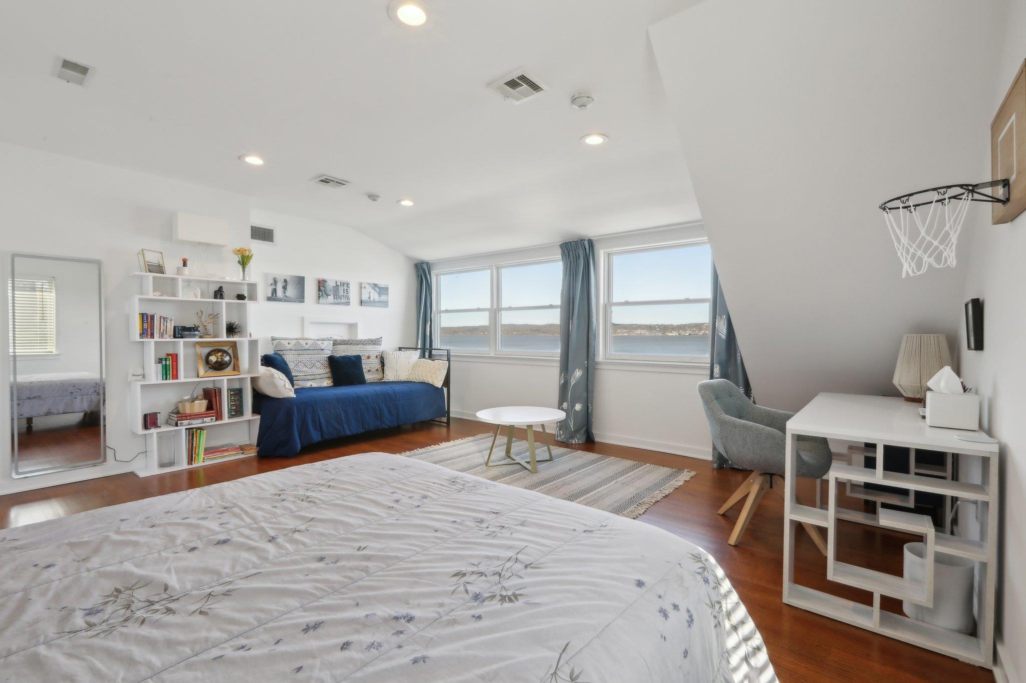 2 Washington Avenue Nyack, NY 10960 - Photo 18 of 50 a bedroom with furniture and a wooden floor