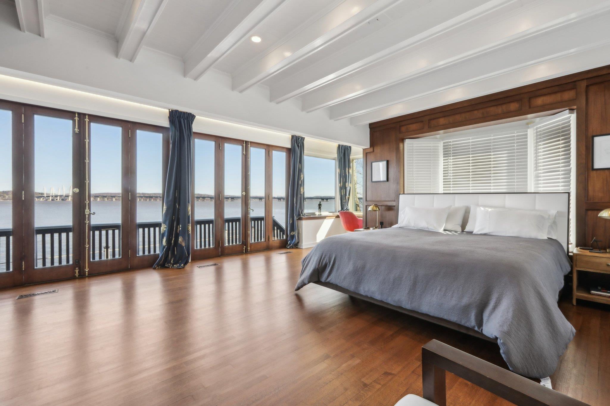 2 Washington Avenue Nyack, NY 10960 - Photo 22 of 50 a bedroom with a large bed and a large window