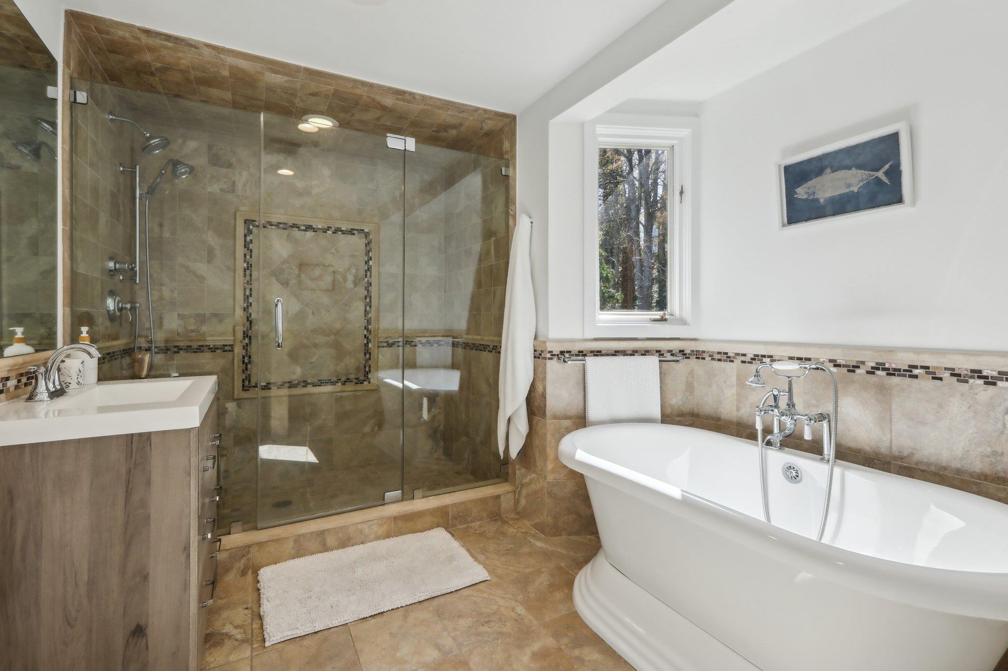 2 Washington Avenue Nyack, NY 10960 - Photo 29 of 50 a white bath tub sitting next to a bathroom