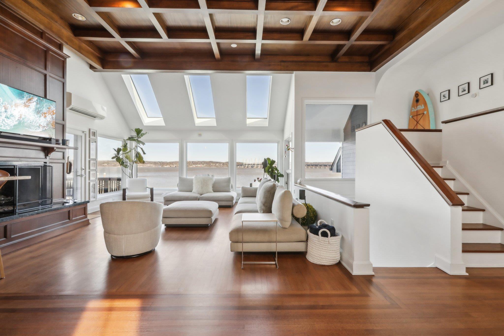 2 Washington Avenue Nyack, NY 10960 - Photo 4 of 50 a living room with couches and a large mirror with wooden floor