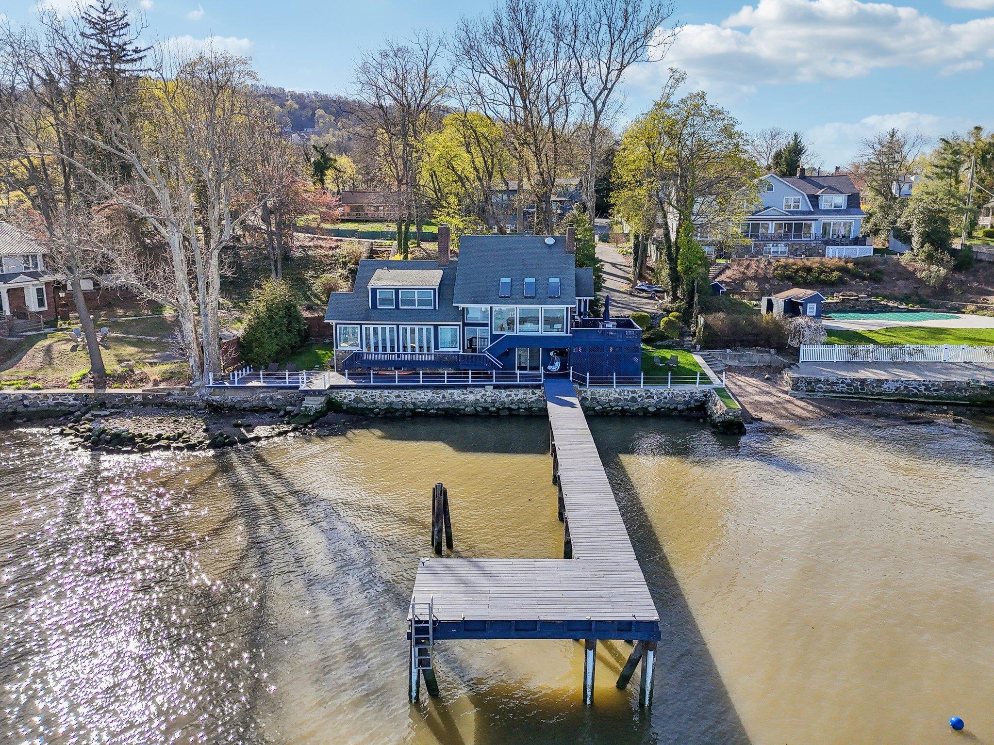 2 Washington Avenue Nyack, NY 10960 - Photo 41 of 50 a small pool with lawn chairs and flat screen tv