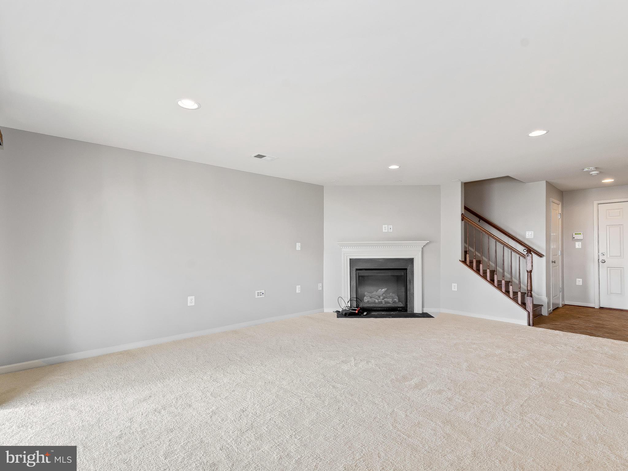 42173 Castle Ridge Square Ashburn, VA 20148 - Photo 27 of 28 Fully finished basement w/ fireplace