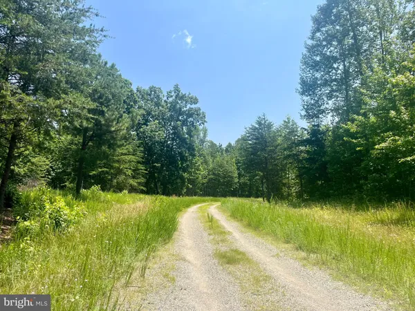 a view of a lake with a yard