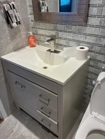 a bathroom with a sink and a toilet