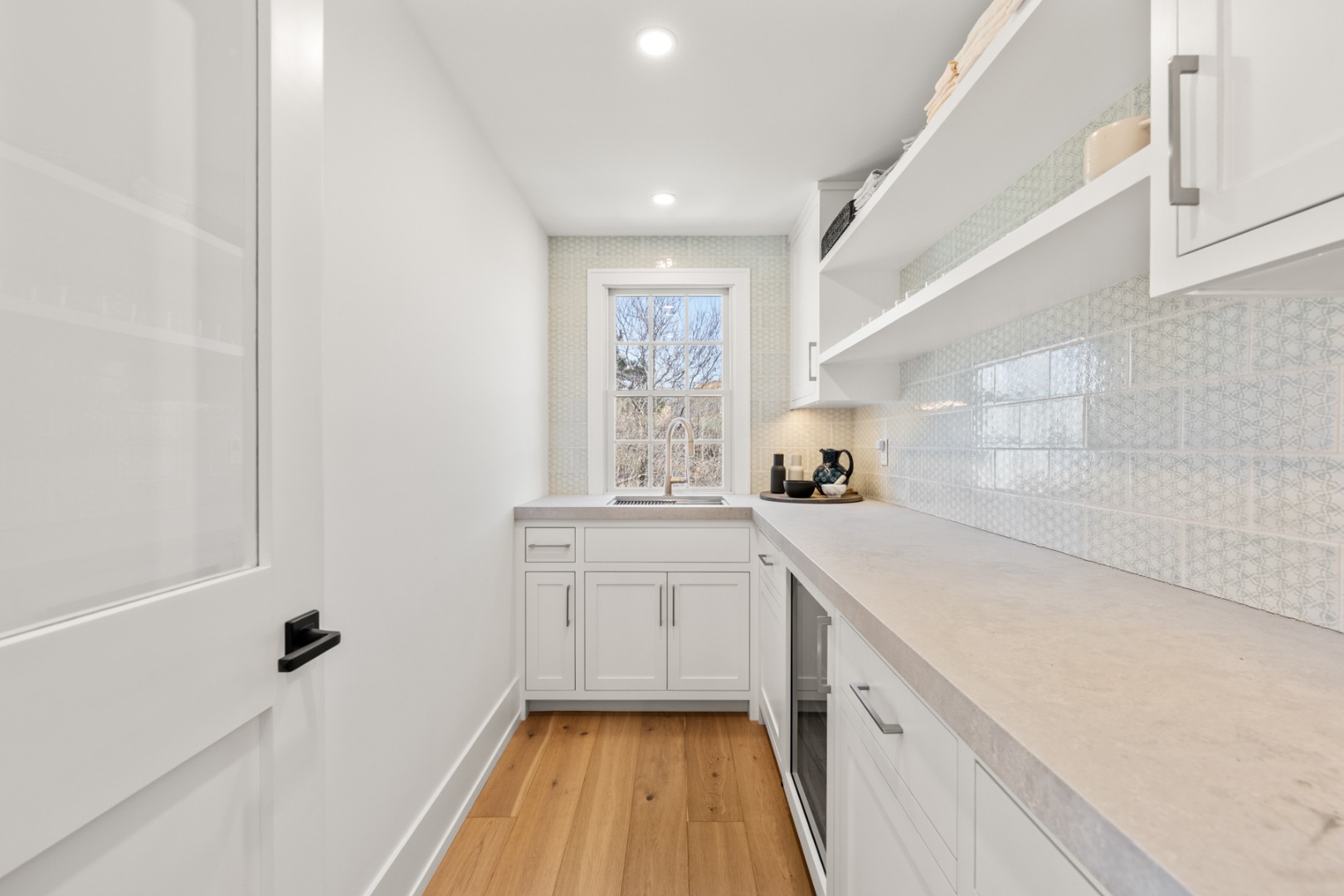 174 Cliff Road Nantucket, MA 02554 - Photo 18 of 49 a kitchen with a sink a window and appliances