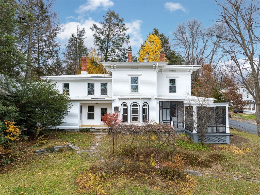 front view of a house with a yard