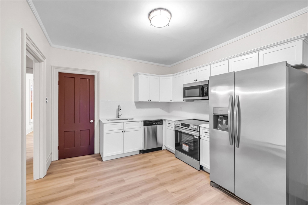 48 Gray Street Amherst, MA 01002 - Photo 20 of 42 a kitchen with a refrigerator stove and sink