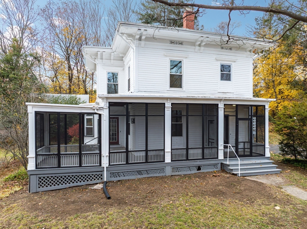 48 Gray Street Amherst, MA 01002 - Photo 2 of 42 a view of a house with a garage and wooden fence