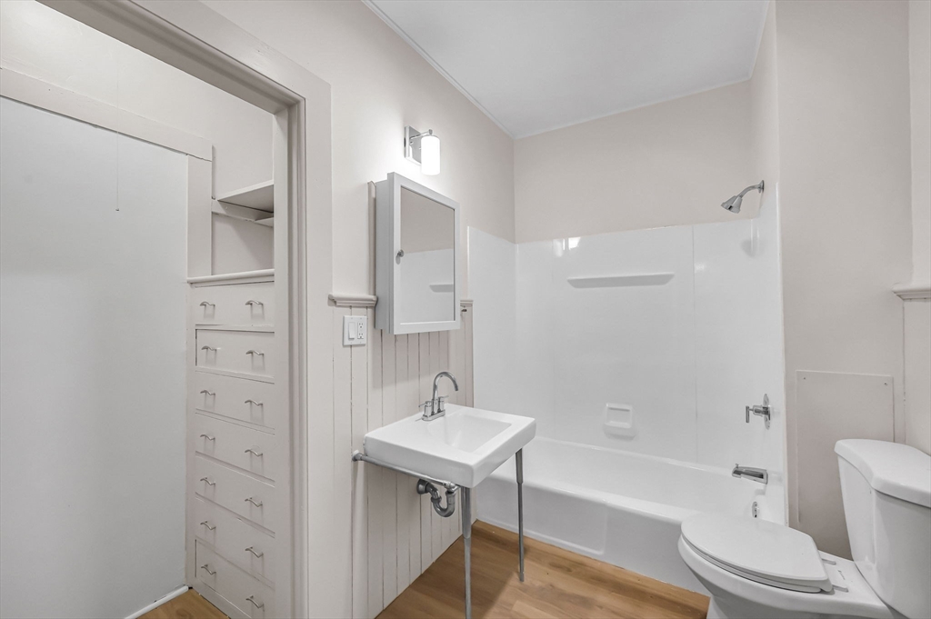 48 Gray Street Amherst, MA 01002 - Photo 22 of 42 a bathroom with a sink a toilet and bathtub