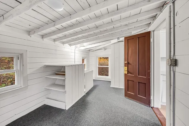 a kitchen with a refrigerator and a sink