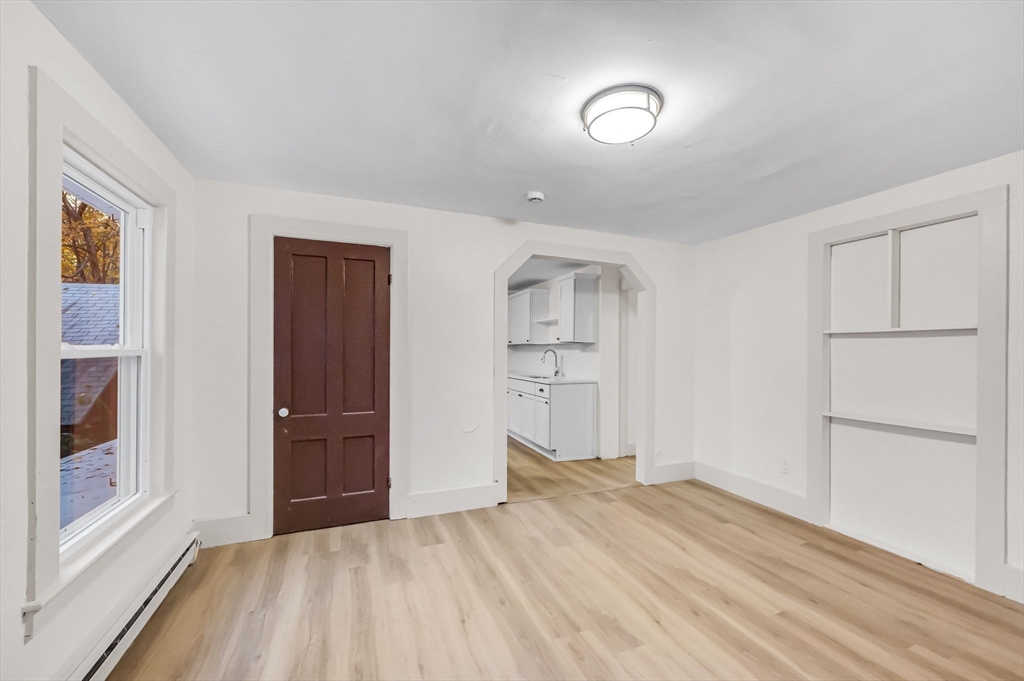48 Gray Street Amherst, MA 01002 - Photo 28 of 42 a view of empty room with wooden floor and windows