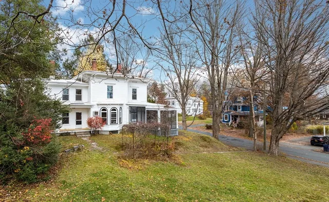 a aerial view of a house with a yard