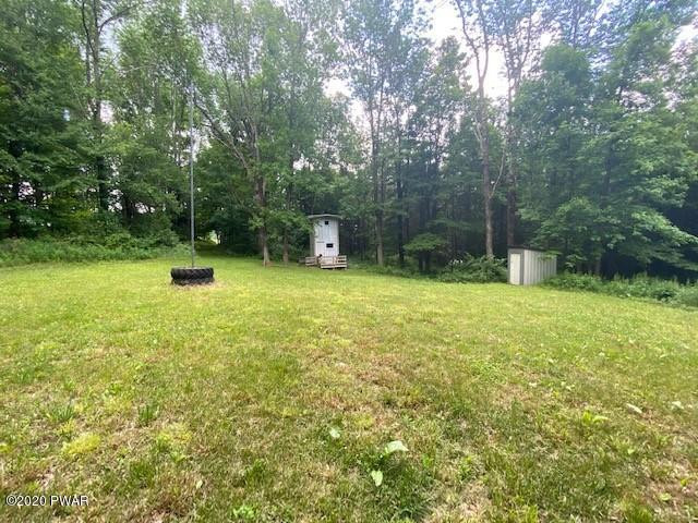 63 Callapoose Road Moscow, PA 18444 - Photo 70 of 73 a view of a backyard with a trees