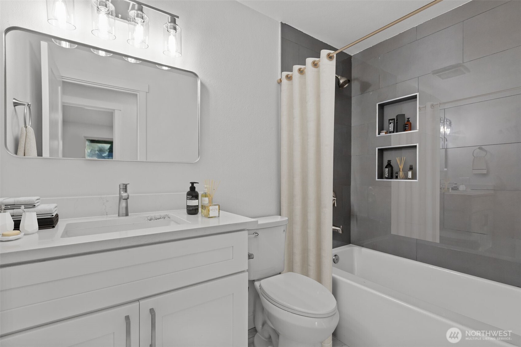 21316 188th Avenue Southeast Renton, WA 98058 - Photo 16 of 40 a bathroom with a sink toilet and shower