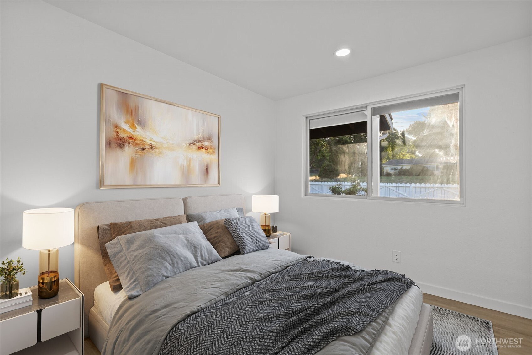 21316 188th Avenue Southeast Renton, WA 98058 - Photo 17 of 40 a bedroom with a bed and a painting on the wall