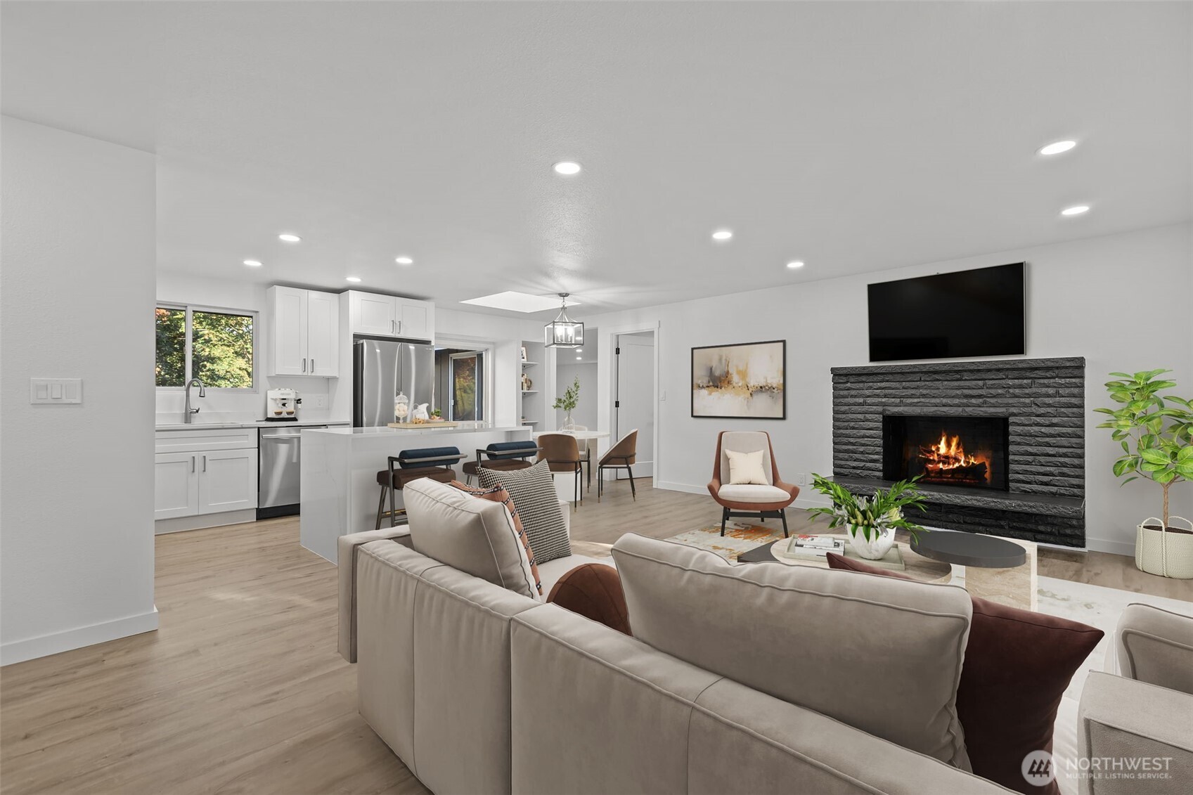 21316 188th Avenue Southeast Renton, WA 98058 - Photo 2 of 40 a living room with fireplace furniture and a flat screen tv