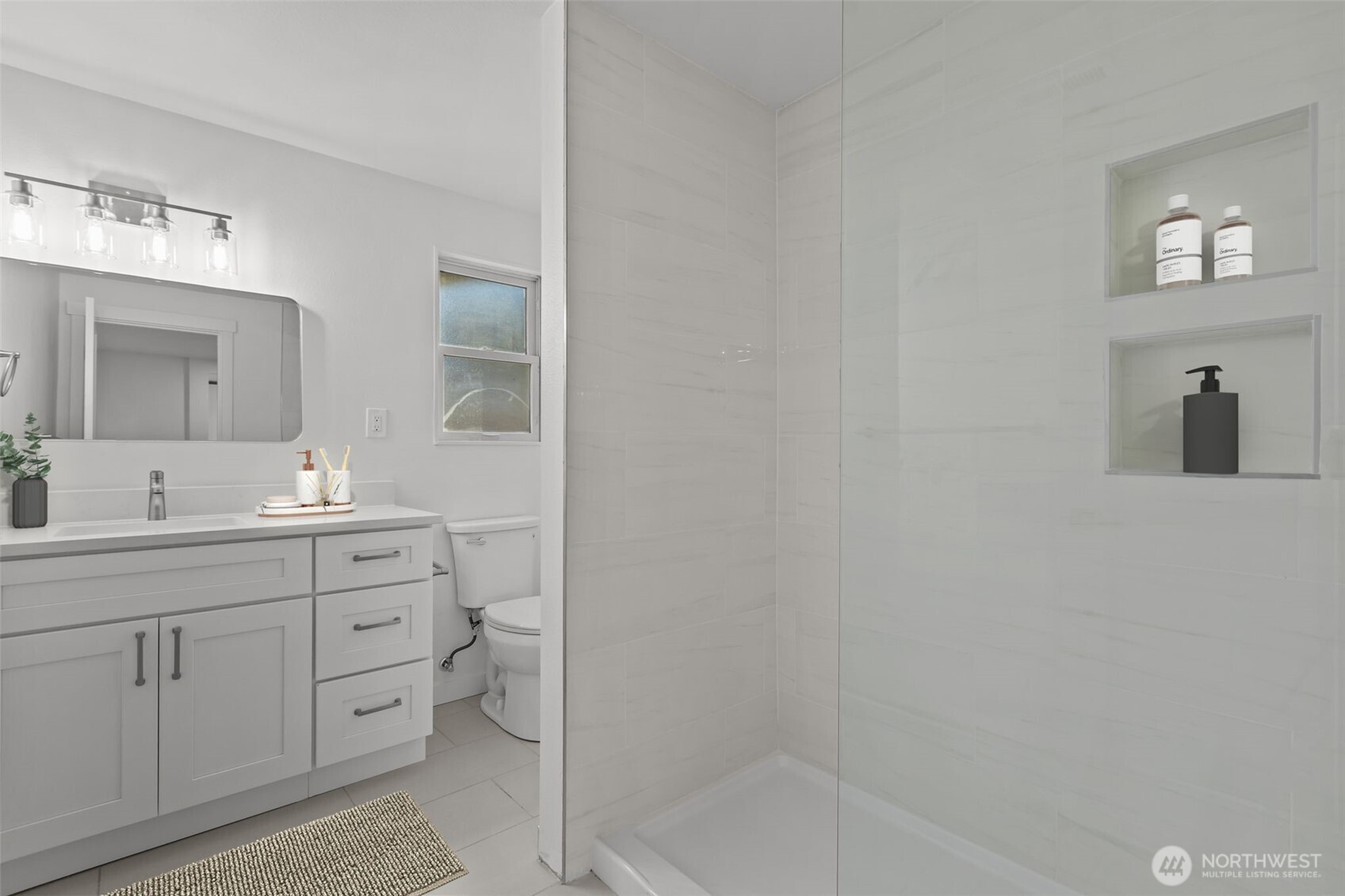 21316 188th Avenue Southeast Renton, WA 98058 - Photo 21 of 40 a bathroom with a double vanity sink a toilet and mirror