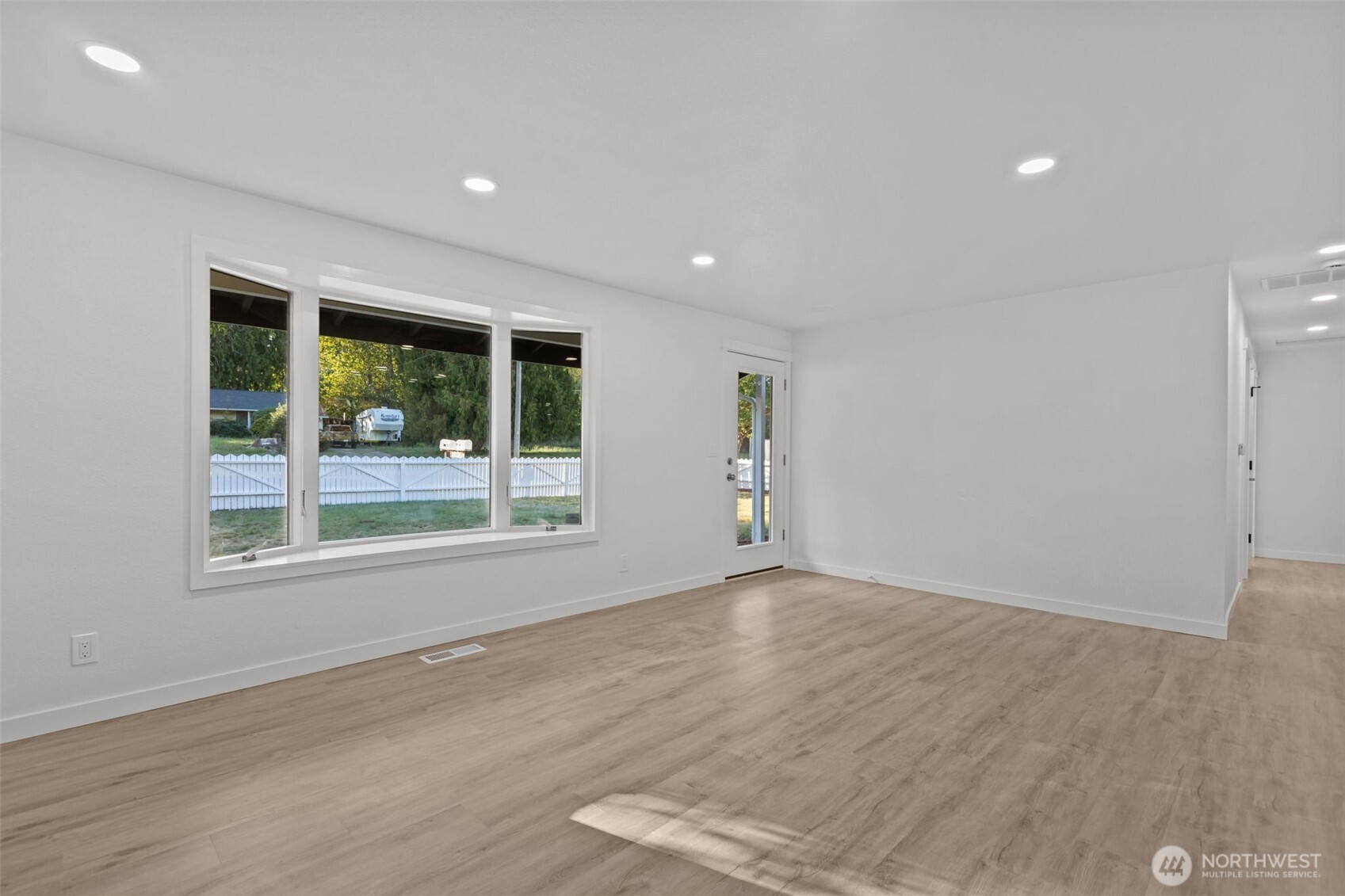 21316 188th Avenue Southeast Renton, WA 98058 - Photo 36 of 40 an empty room with wooden floor and windows