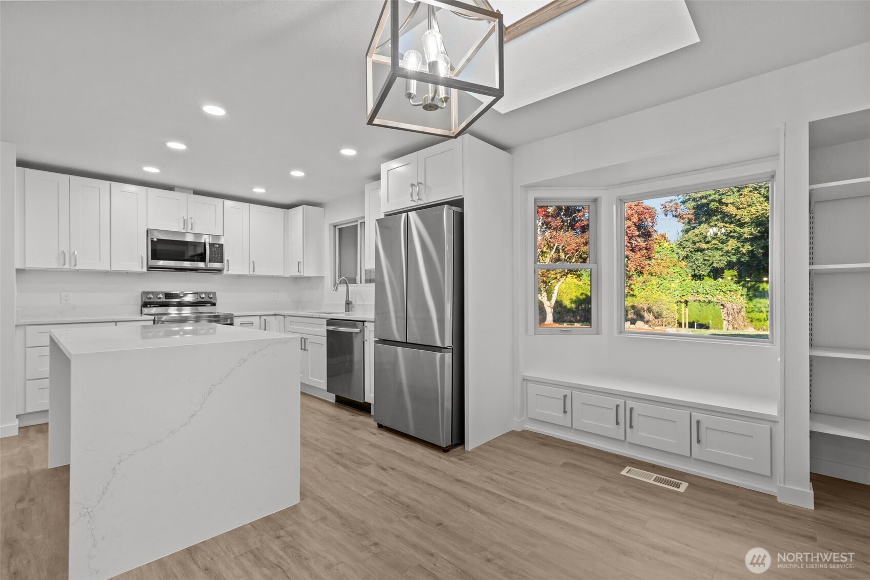 21316 188th Avenue Southeast Renton, WA 98058 - Photo 39 of 40 a kitchen with refrigerator cabinets and wooden floor