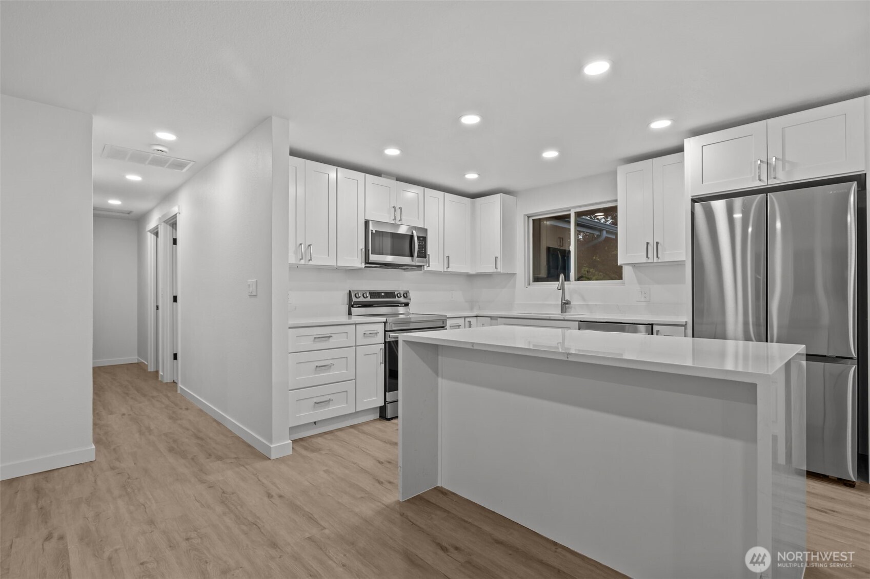 21316 188th Avenue Southeast Renton, WA 98058 - Photo 40 of 40 a kitchen with kitchen island a sink stainless steel appliances and cabinets