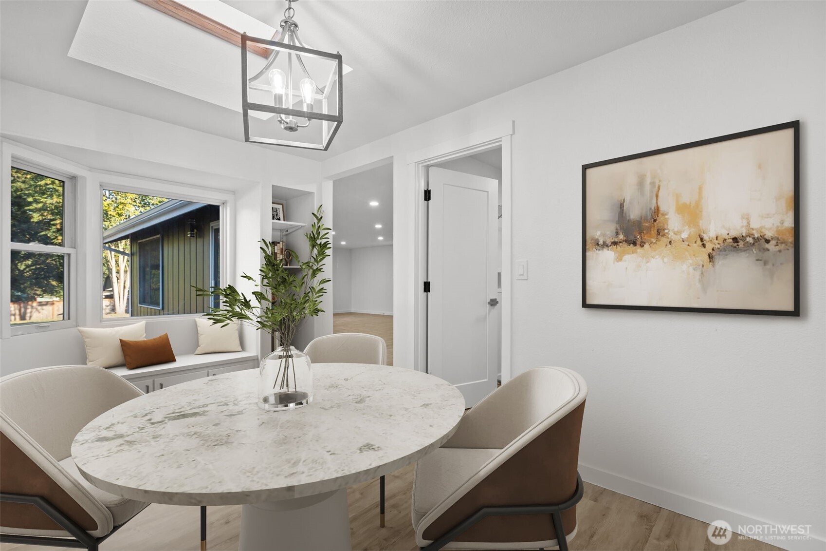 21316 188th Avenue Southeast Renton, WA 98058 - Photo 5 of 40 a view of a dining room with furniture and a chandelier