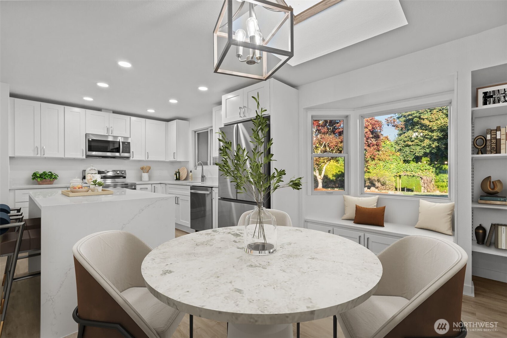 21316 188th Avenue Southeast Renton, WA 98058 - Photo 6 of 40 a kitchen with stainless steel appliances granite countertop a kitchen island hardwood floor sink stove and dining table