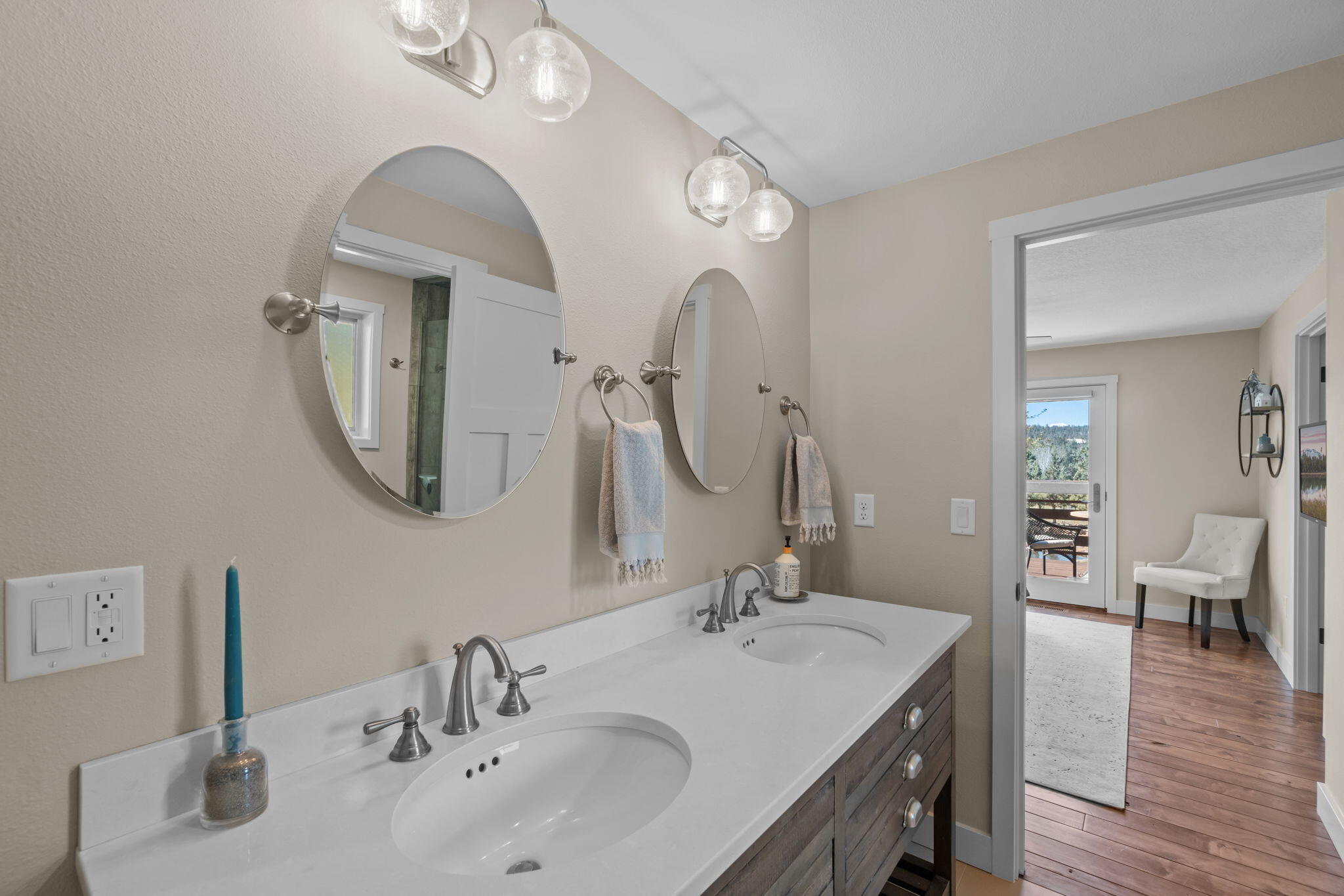 19395 Innes Market Road Bend, OR 97703 - Photo 40 of 75 a en suite bathroom with a double vanity sink and a mirror