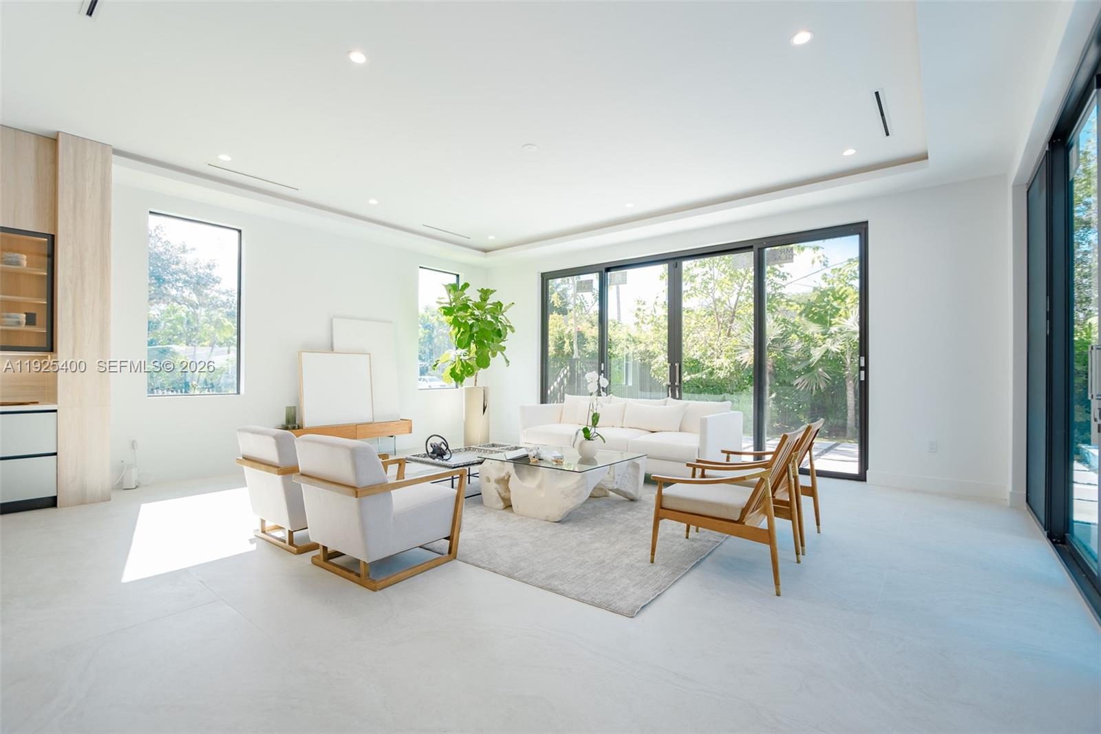 9840 Southwest 73rd Court Pinecrest, FL 33156 - Photo 47 of 67 Oversize Family Room with natural light and overlooking to the pool