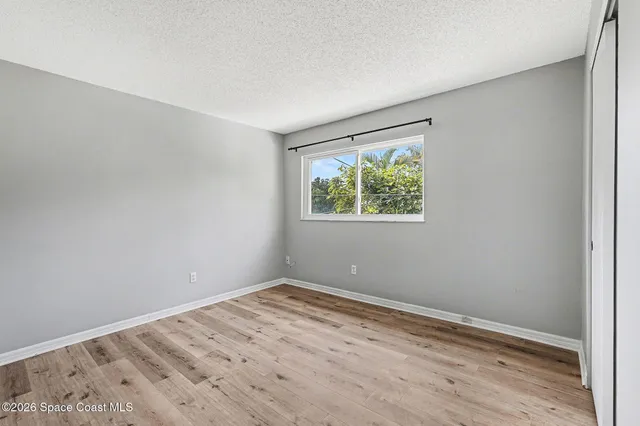 a view of room with window and closet