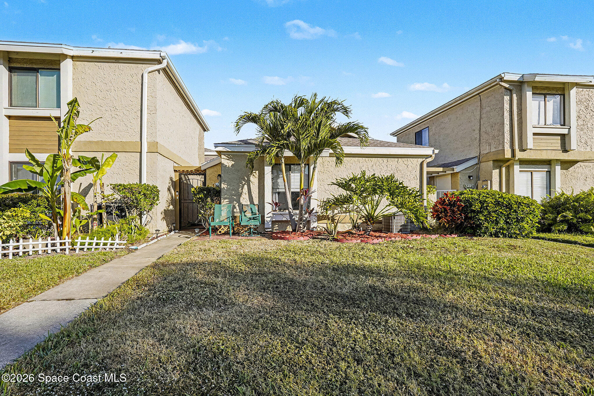 1491 Sheafe Avenue Northeast, Unit 104 Palm Bay, FL 32905 - Photo 1 of 19 a house view with a outdoor space