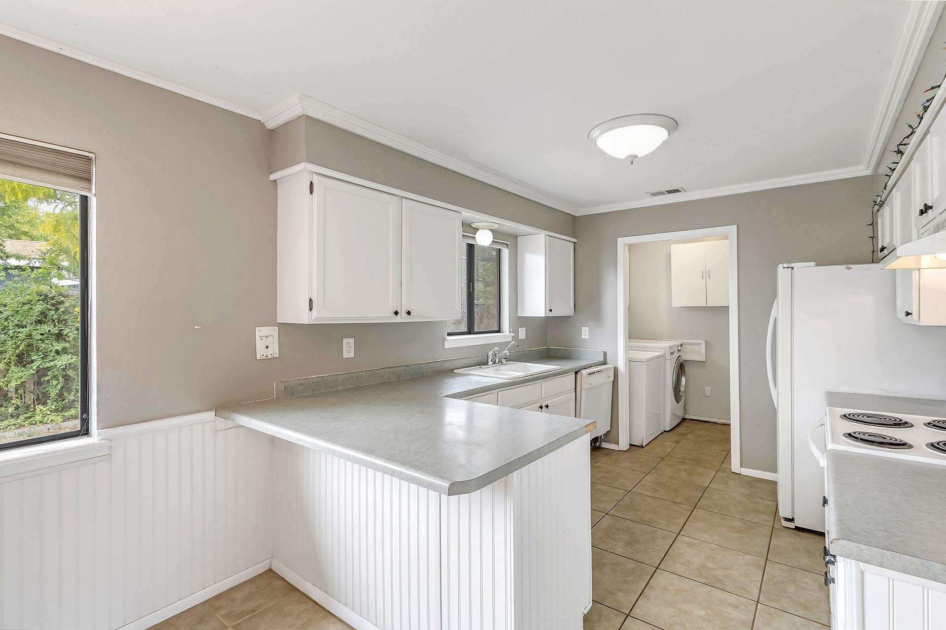 483-30 C 3/4 Road Grand Junction, CO 81504 - Photo 5 of 25 a kitchen with a refrigerator a sink and a stove