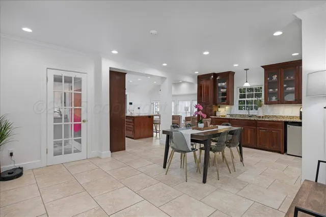 a kitchen with a sink cabinets and stainless steel appliances