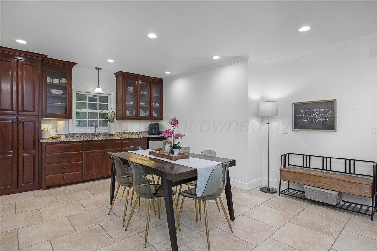 2819 South Hayden Street Amarillo, TX 79109 - Photo 17 of 56 a kitchen with stainless steel appliances kitchen island granite countertop a sink and cabinets