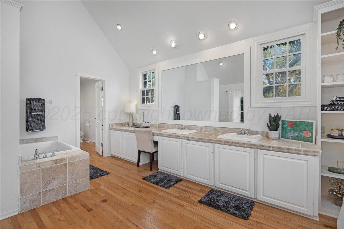 2819 South Hayden Street Amarillo, TX 79109 - Photo 22 of 56 a large white kitchen with a sink and cabinets