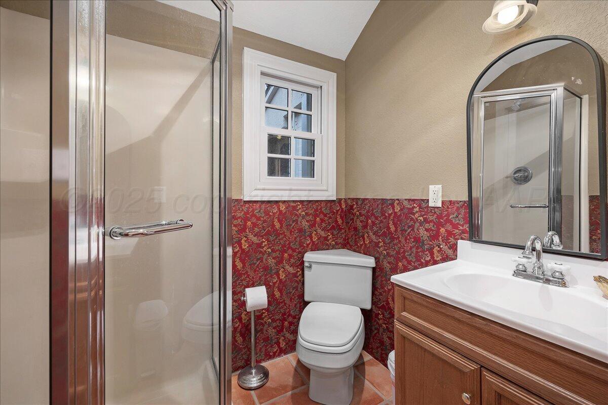 2819 South Hayden Street Amarillo, TX 79109 - Photo 29 of 56 a bathroom with a sink a toilet and shower