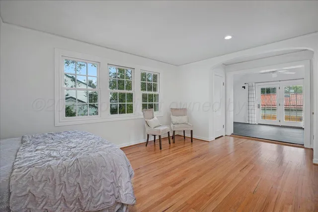 a bedroom with furniture and a window