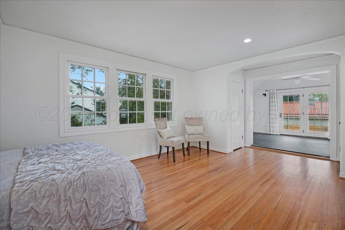 2819 South Hayden Street Amarillo, TX 79109 - Photo 35 of 56 a view of a bedroom with wooden floor and a window