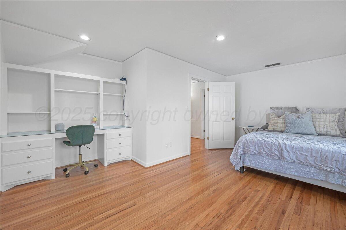 2819 South Hayden Street Amarillo, TX 79109 - Photo 36 of 56 a living room with furniture and a wooden floor