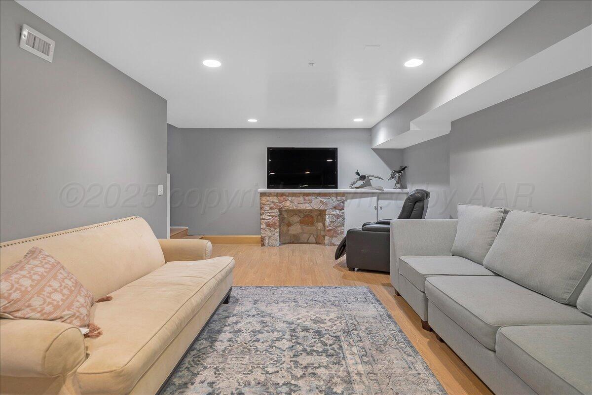 2819 South Hayden Street Amarillo, TX 79109 - Photo 42 of 56 a living room with furniture and a flat screen tv