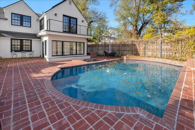 a view of a brick house with a bench