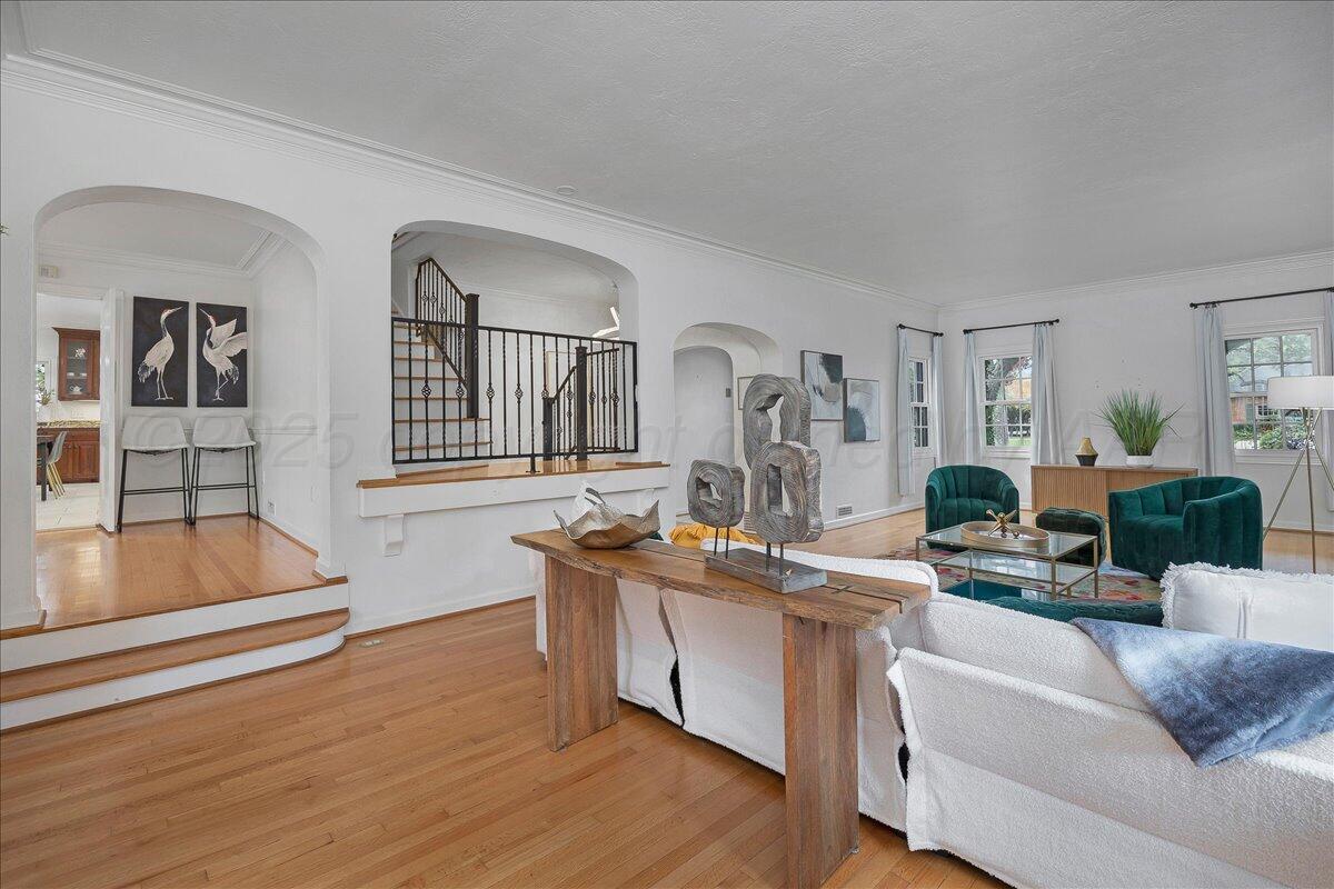 2819 South Hayden Street Amarillo, TX 79109 - Photo 7 of 56 a living room with furniture and a wooden floor