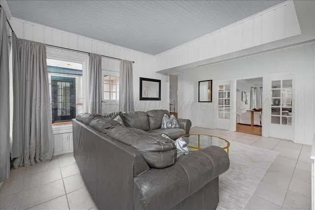 a living room with furniture and a table