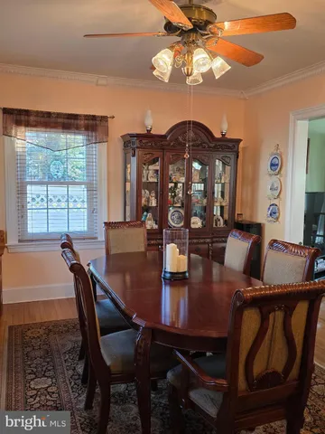 a kitchen with stainless steel appliances a stove a sink cabinets and a refrigerator