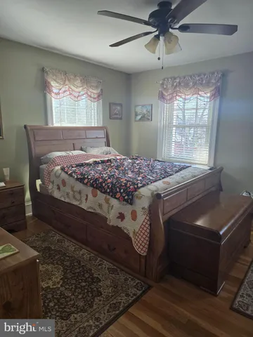 a bathroom with a toilet and a window