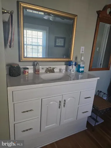 a bedroom with a bed and a rug