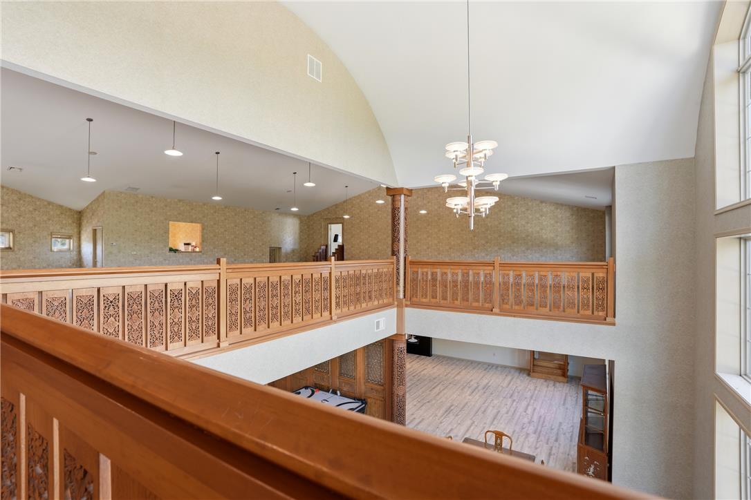 6271 Batman Road Zionsville, PA 18092 - Photo 68 of 100 Ornate wood railings adorn this multi-level great room with vaulted ceilings and abundant natural light.