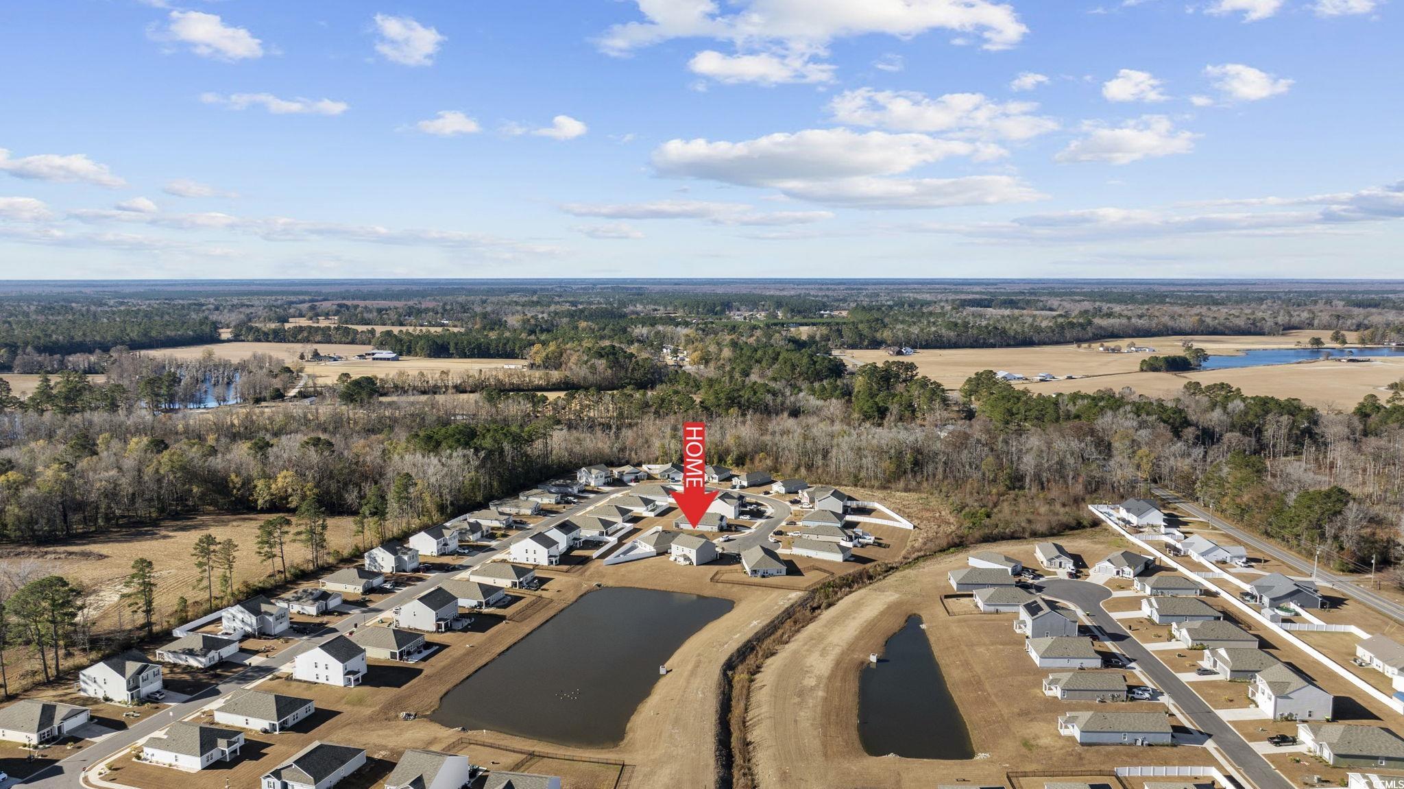 519 Harvest Rdg Way Conway, SC 29527 - Photo 6 of 6 Aerial view of property's location featuring a large body of water and nearby suburban area