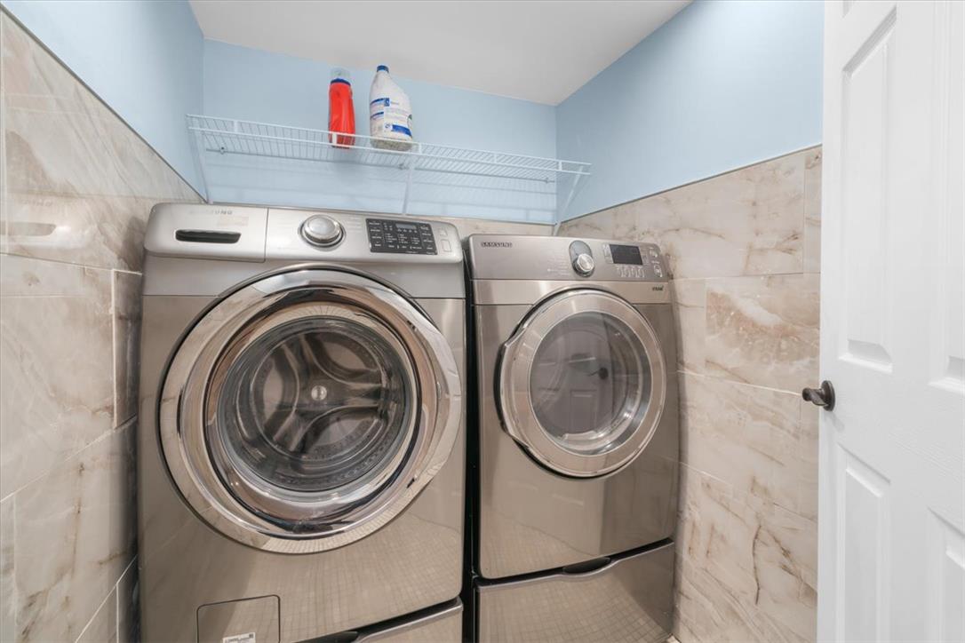 988 Hoch Road Danielsville, PA 18038 - Photo 18 of 29 A well-appointed laundry space features a modern washer and dryer set, enhancing daily routines.