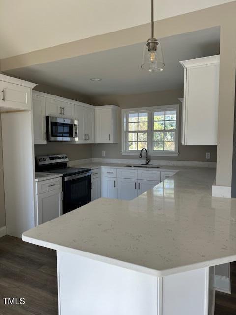 552 Rowan Road Clinton, NC 28328 - Photo 35 of 46 a large kitchen with stainless steel appliances granite countertop a sink a stove top oven a counter space and cabinets